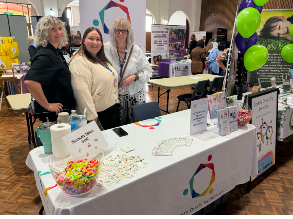 Photo of Liberty employees: Jo, Elisha and Kathie at a disability expo.